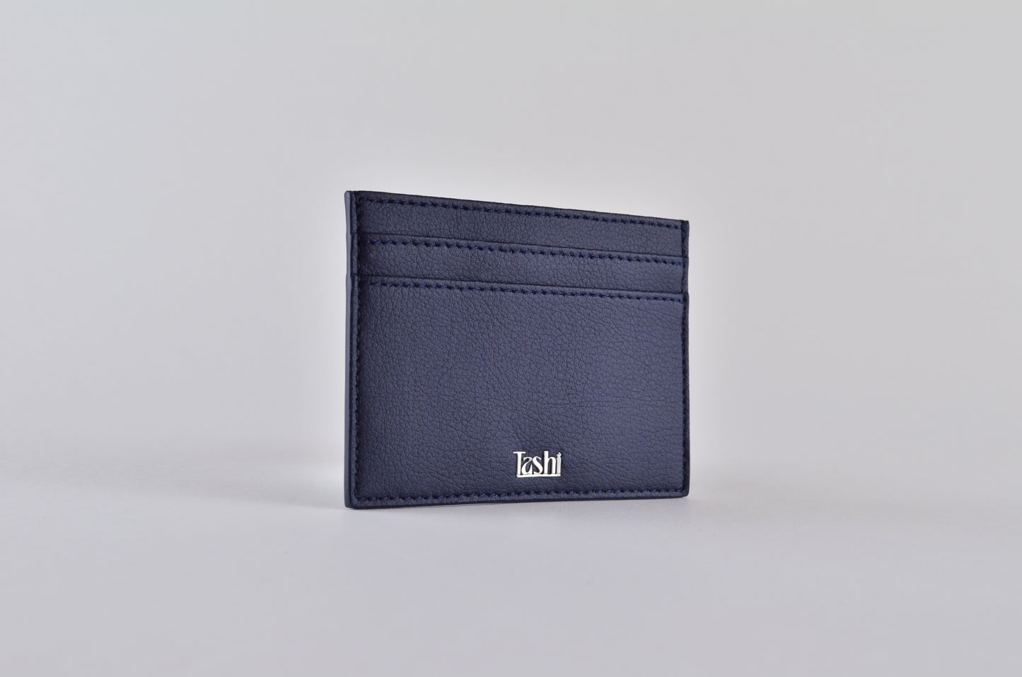 Sustainable fashion accessory: Tashi SARL's navy cactus leather cardholder. three quater view