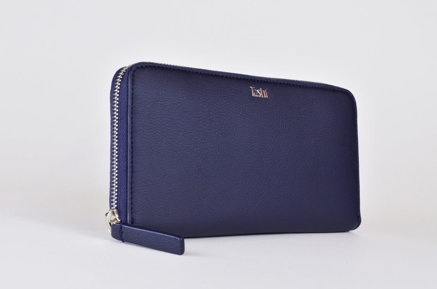 Sustainable fashion accessory: Tashi SARL's navy cactus leather wallet. Three quater view