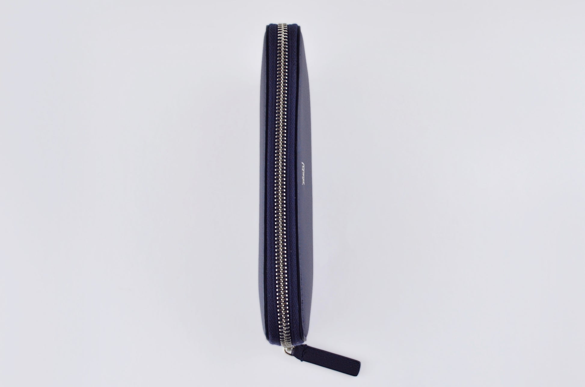 Sustainable fashion accessory: Tashi SARL's navy cactus leather wallet. Top view